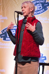 close up photo of Carol Hale sharing a story on stage