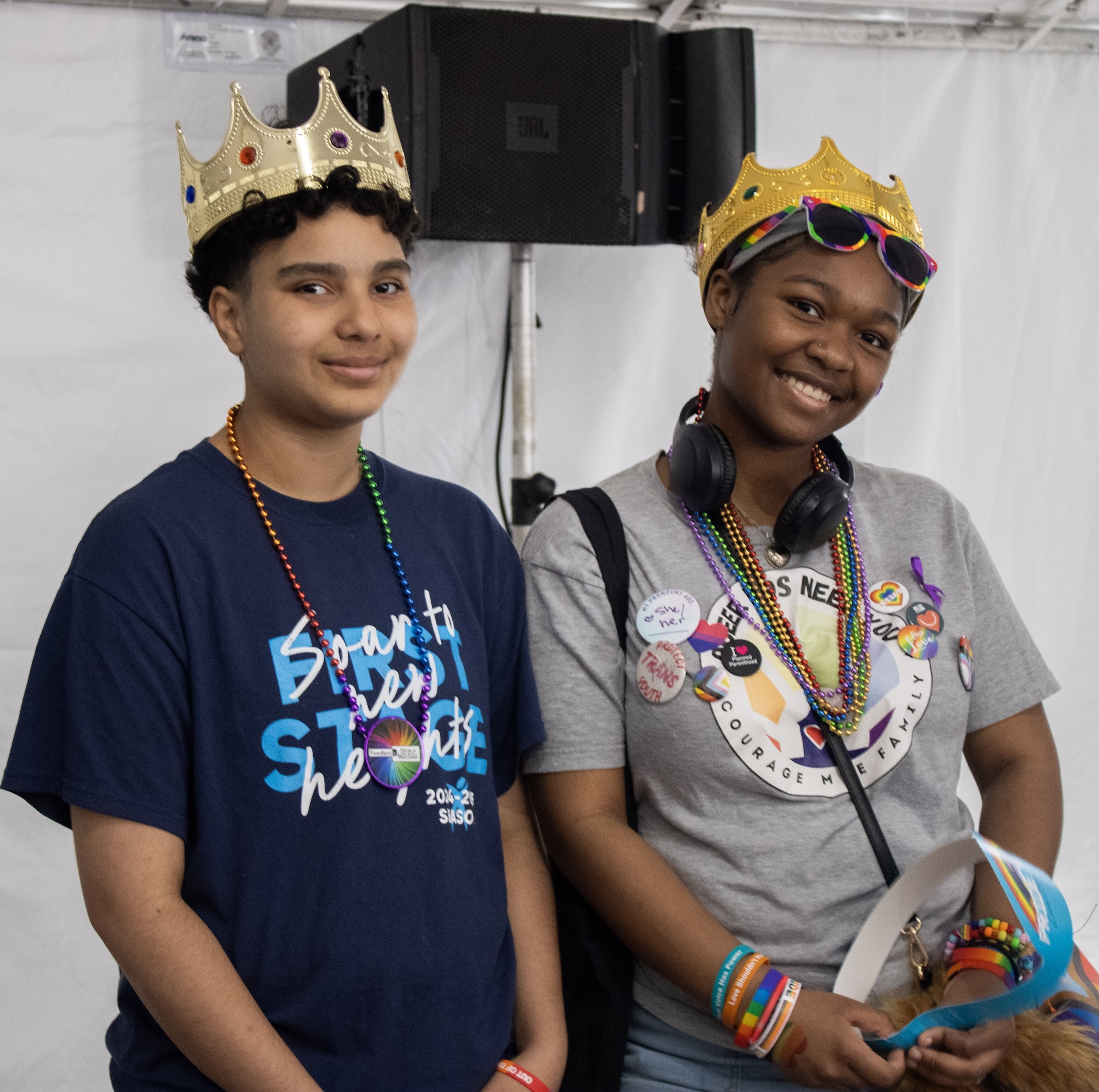 Photo of two young people wearing crowns on their heads after winning a Teen Slam