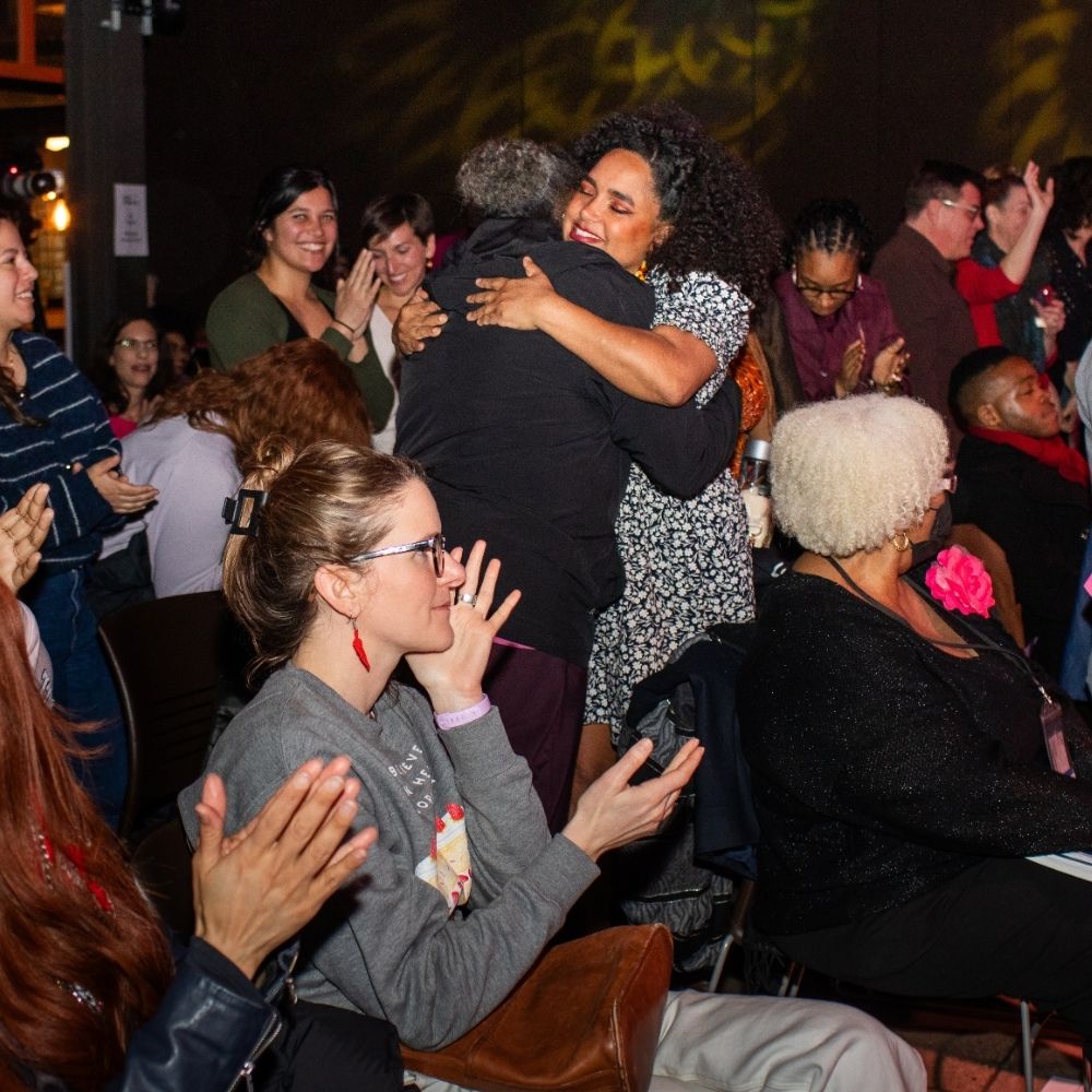 Feb 2026 ADFTC Image of audience members embracing during AfterDark: For the Culture in February 2026